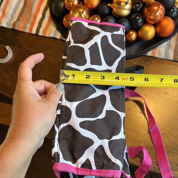 Zebra print bag. Black with pink handle and trim. Used several times. - Picture 7 of 7